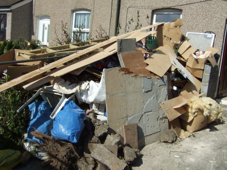 A skip filled with construction waste on a building site